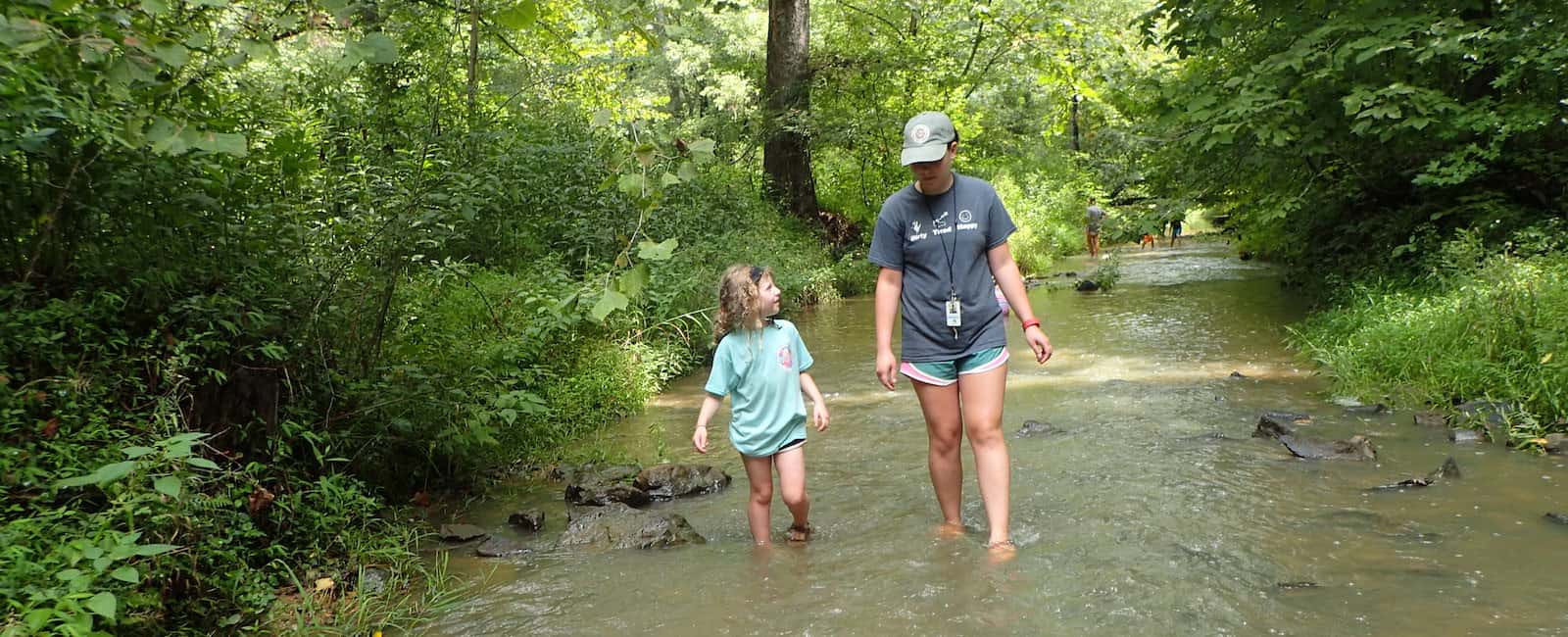 counselor-and-child-wading